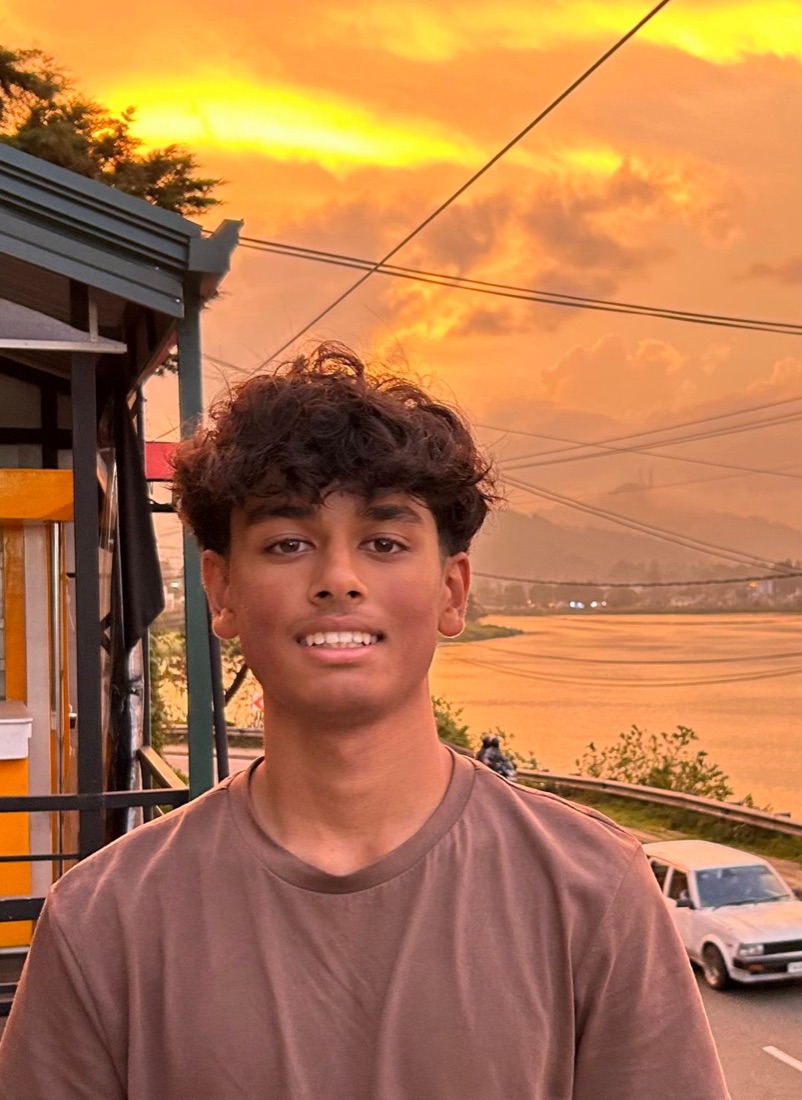 Aditya Kothari at sunset by a lake